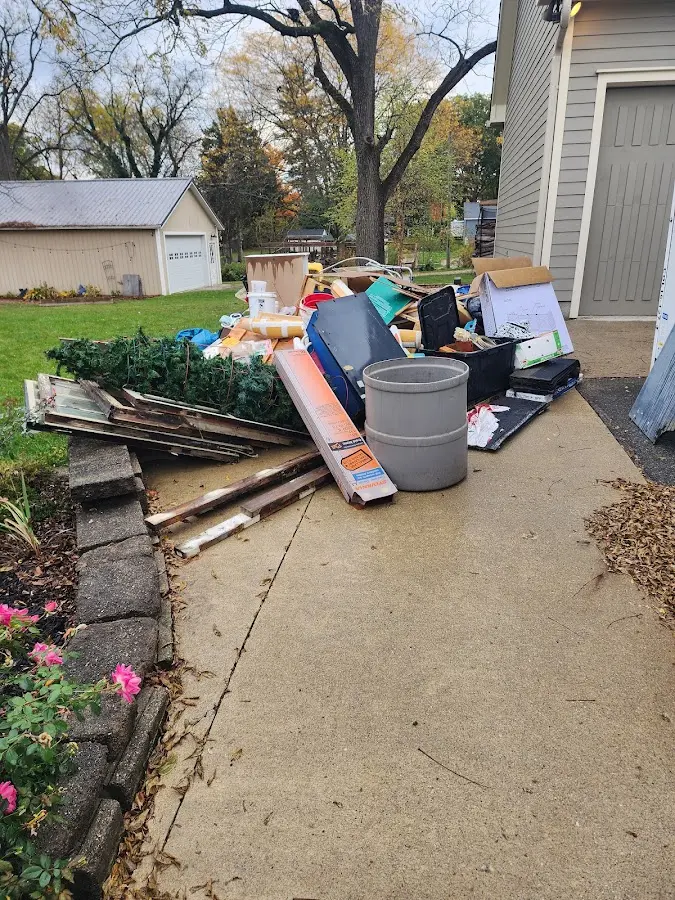 Dumpster being loaded with debris for Residential Dumpster Rental in Canton